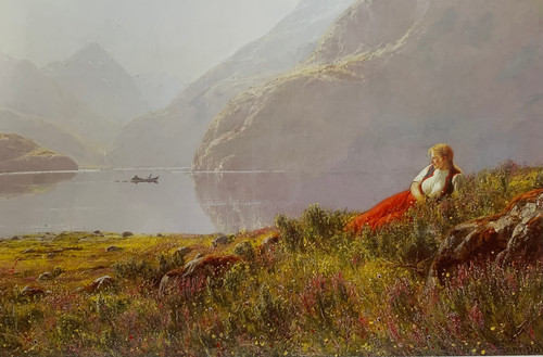 Ung jente i fjordlandskap