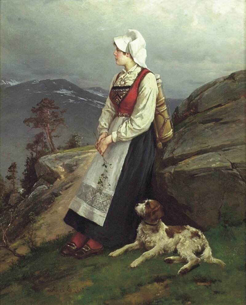 Ung bunadkledd kone med hund