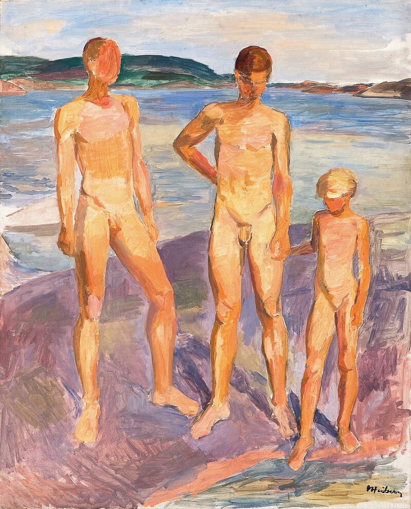 Two boys and a girl on a coastal rock
