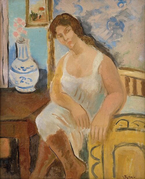 Seated woman in an interior